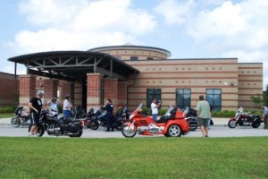 Goldwing trike with motorcycle marshal group