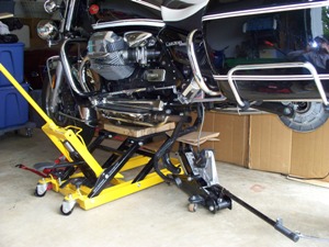 lifting a Moto Guzzi California Vintage motorcycle to remove rear wheel